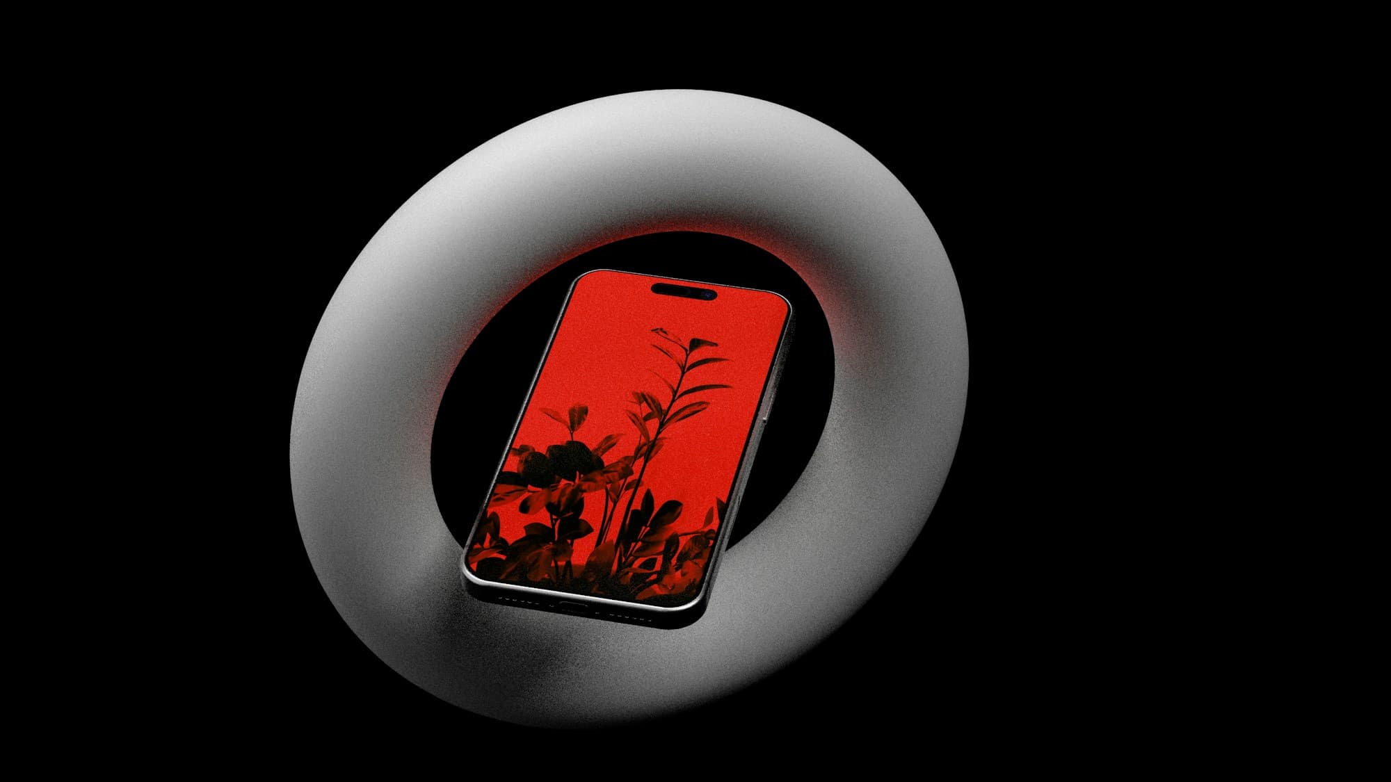 Phone with a red screen resting inside a white ring